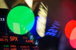 A monitor displays stock market information on the floor of the New York Stock Exchange (NYSE) in New York, U.S., on Monday, Dec. 13, 2021.