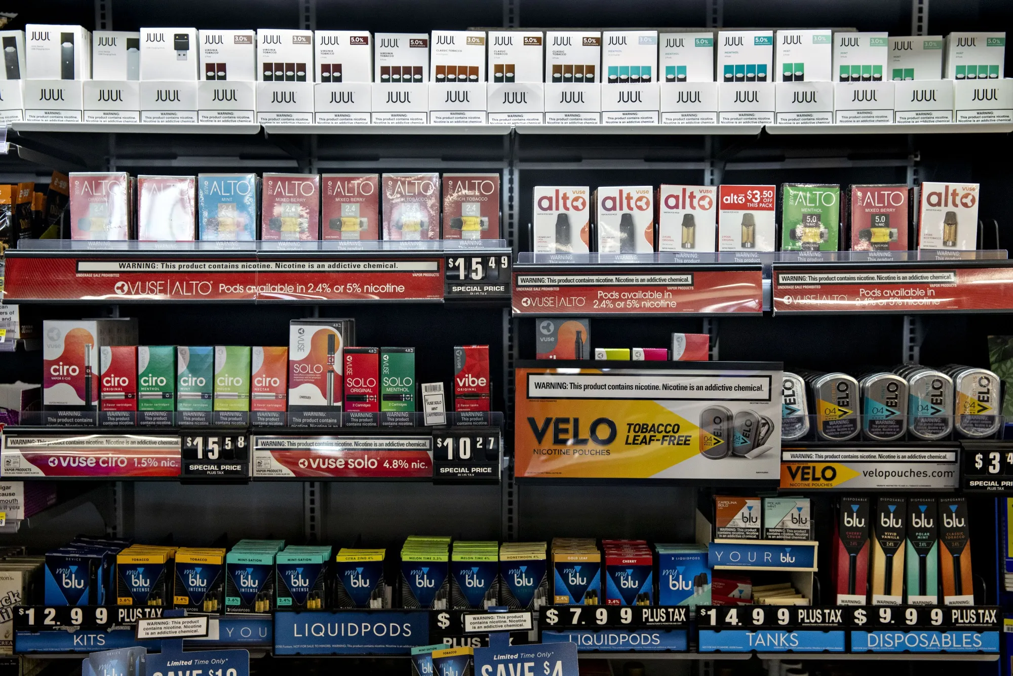 E-cigarettes and refill cartridges are displayed at a store in Princeton, Illinois. Early indications that vaping could lead to&nbsp;lung disease weren’t immediately recognized as a hints of a larger problem, documents and medical articles suggest.