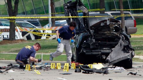 FBI investigators work a crime scene outside of the Curtis Culwell Center after a shooting.