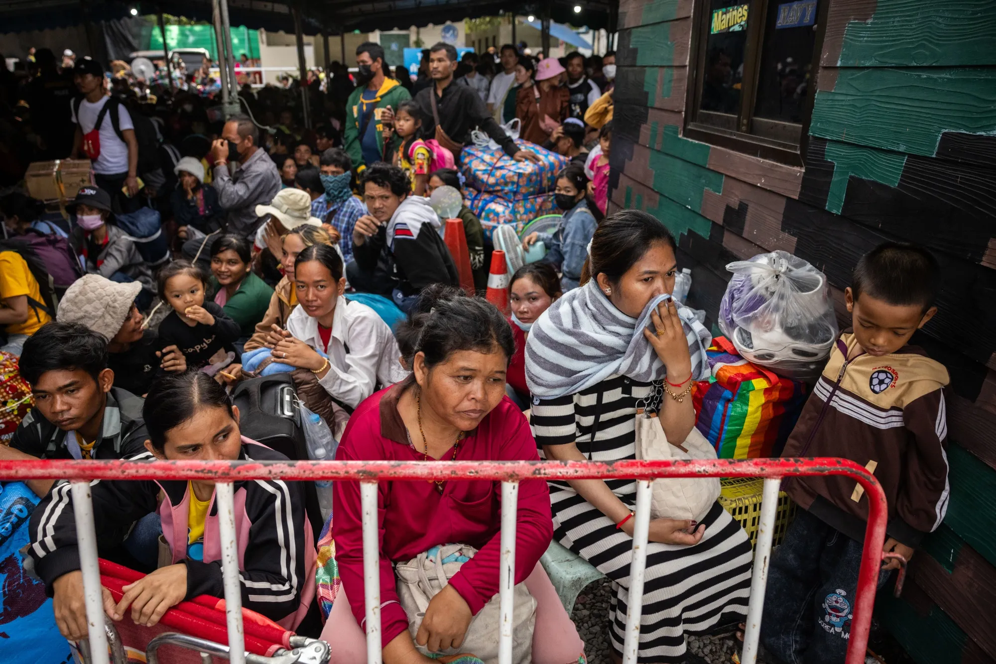 Cambodian migrant workers wait to cross the Ban Laem border checkpoint in Chanthaburi, Thailand on July 29.