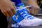 Stephen Curry of the Golden State Warriors ties his Under Armour basketball shoes.