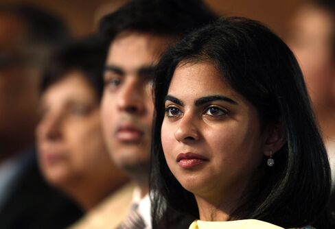 Isha Ambani, right, and Akash Ambani, second right.