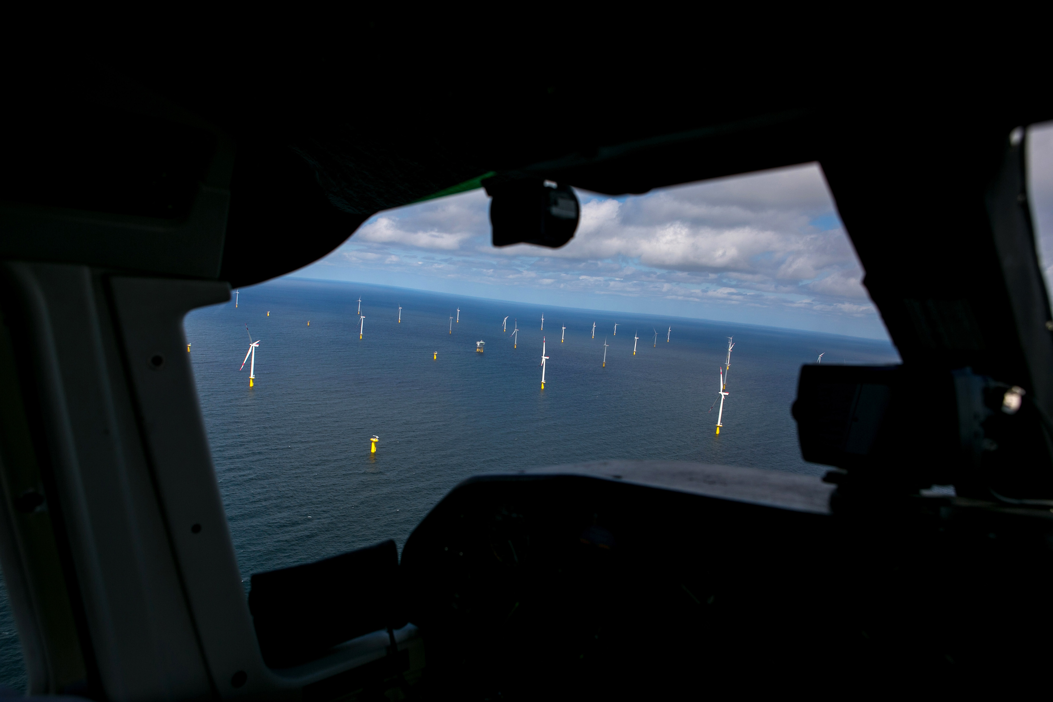 Wind turbines stand in the North Sea off the coast of the Heligoland archipelago in Germany.