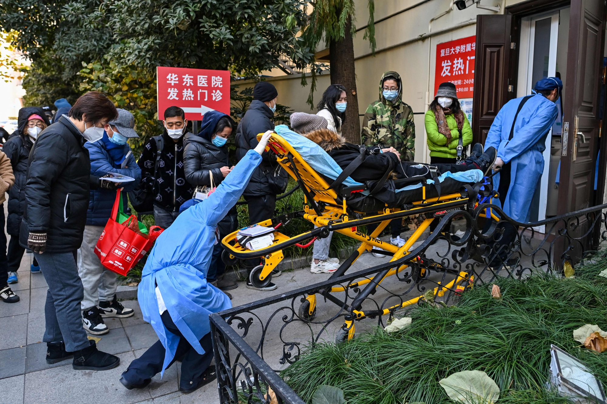 A patient is transported to a fever clinic at Huadong hospital in Shanghai on Dec. 19.