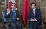 Wang Yi and Justin Trudeau in Ottawa on Wednesday.
