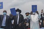 Abdel Fattah al-Burhan, left, Salva Kiir, center, and Idriss Deby hold copies of the South Sudan peace deal, in Juba, South Sudan, Oct. 4.