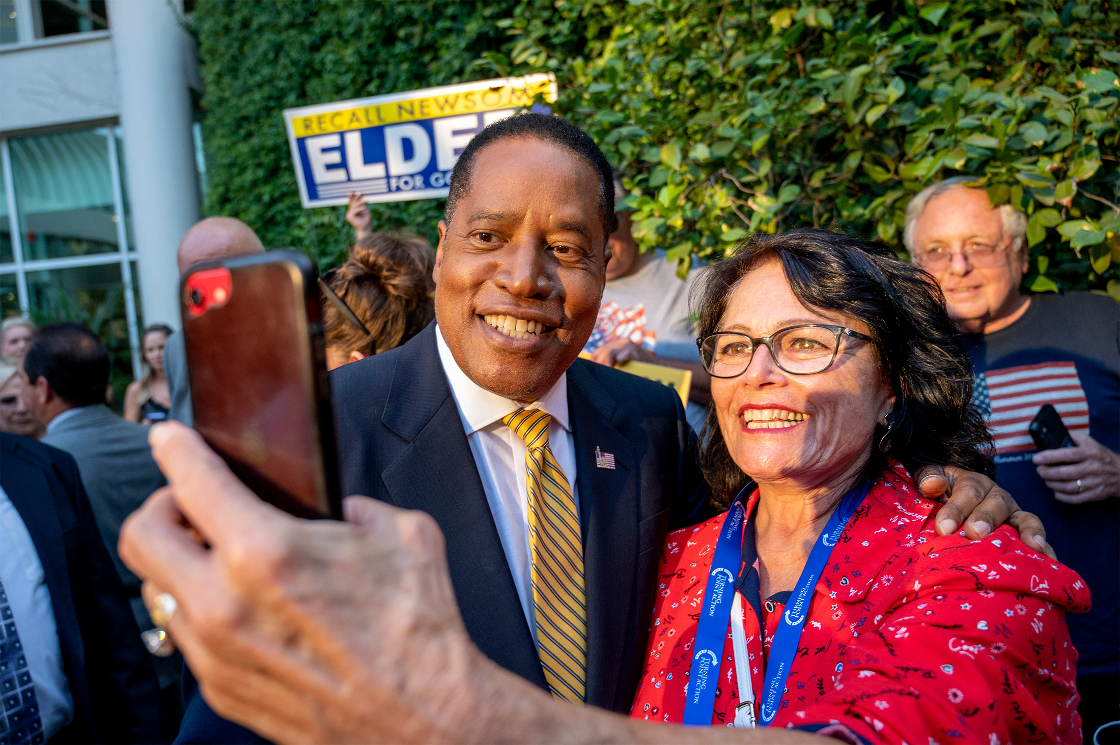  Larry Elder takes a selfie with a supporter in Woodland Hills, California, on Aug. 24.