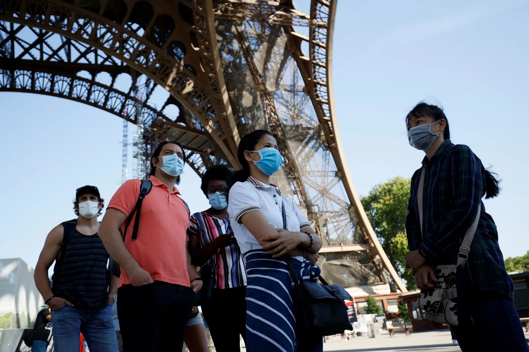 Tourists and Parisians&nbsp;are once again able to admire the view from the Eiffel Tower, but only if they wear a mask and take the stairs.