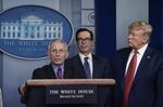 National Institute of Allergy and Infectious Diseases Director Anthony Fauci speaks as U.S. President Donald Trump and Treasury Secretary Steven Mnuchin look on during a briefing on the coronavirus pandemic at the White House on March 25, 2020.