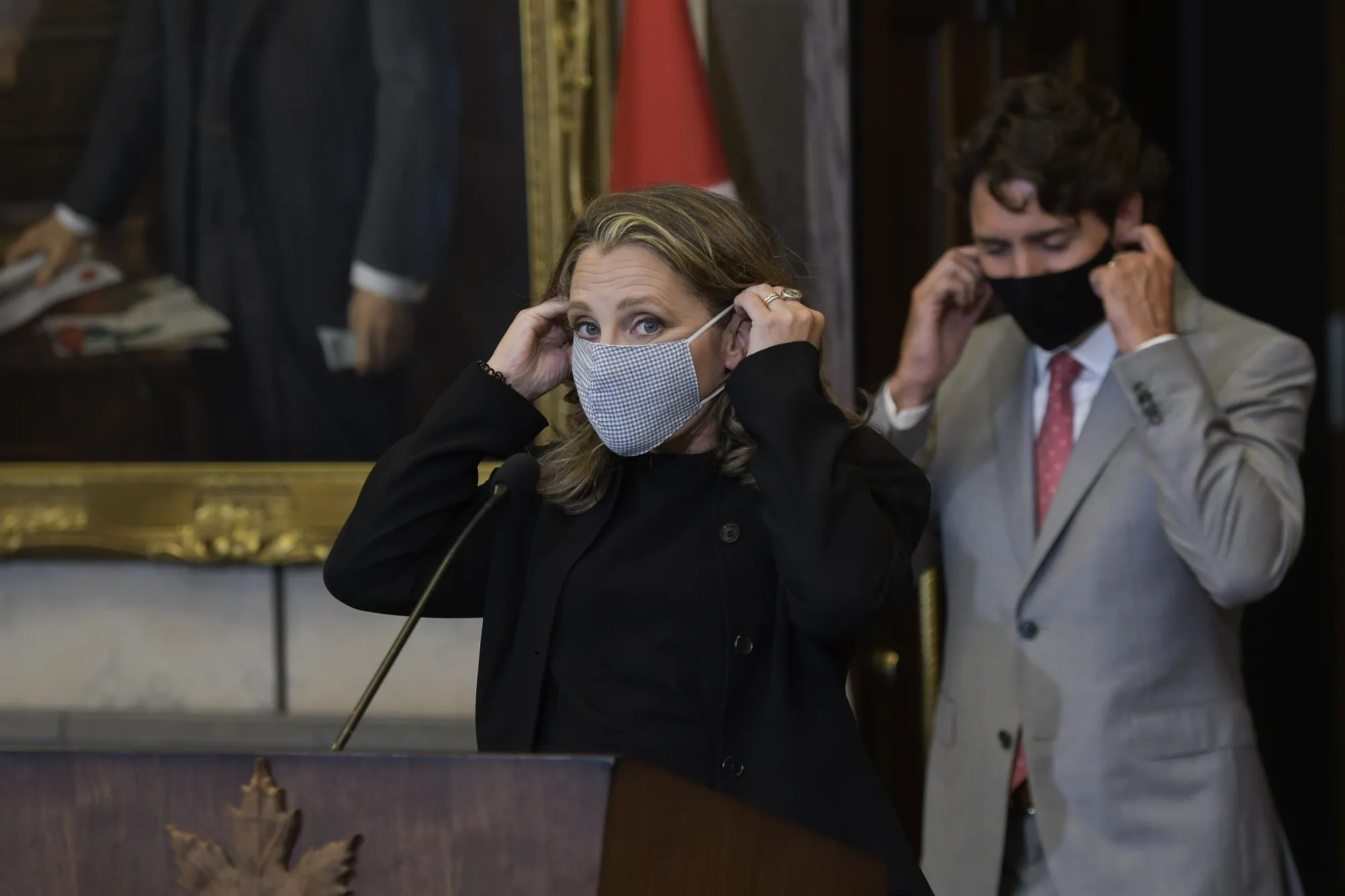 Chrystia Freeland and Justin Trudeau put on masks after an Aug. 18 news conference announcing her appointment as finance minister.