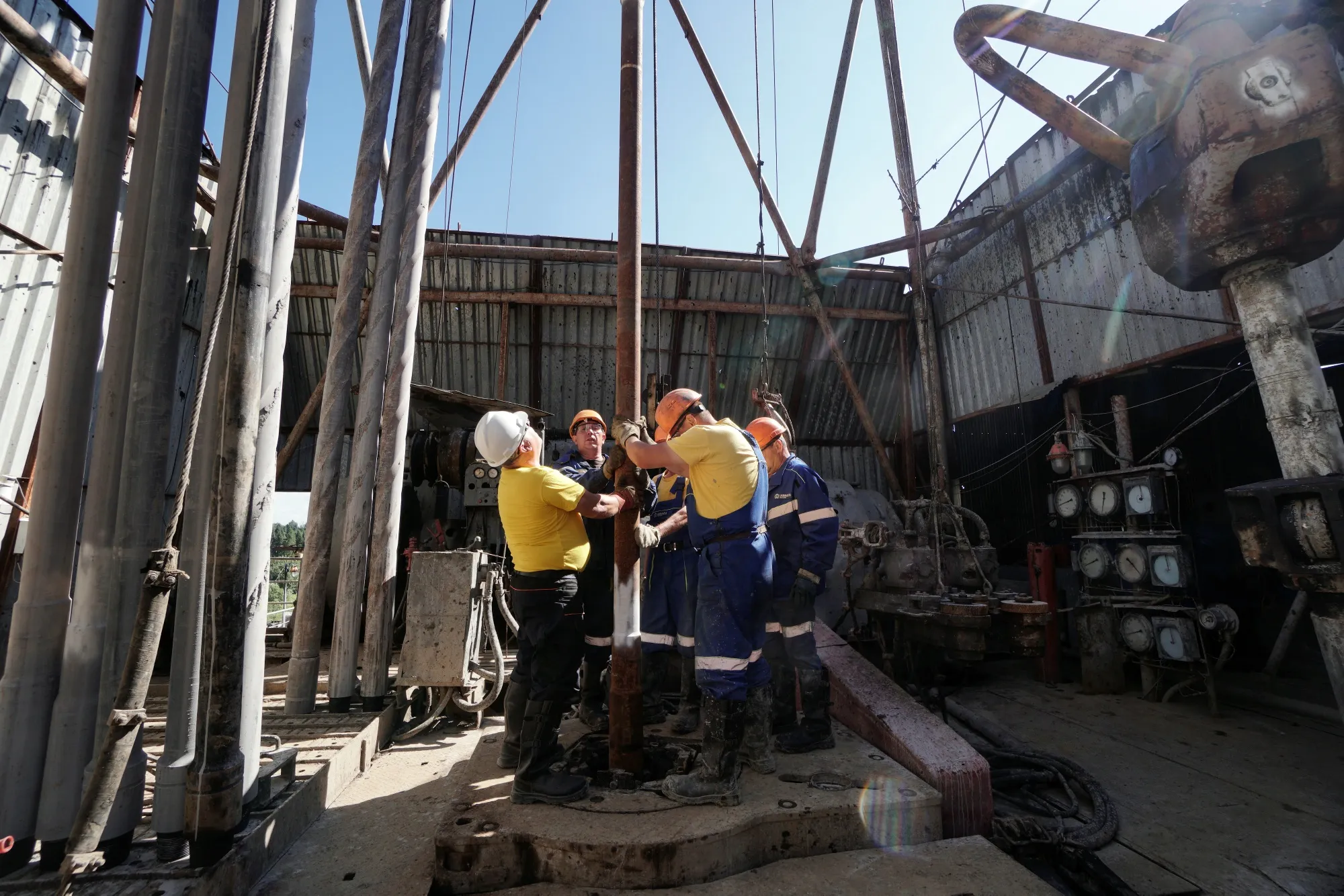 Workers position pipework on an oil drilling platform&nbsp;in Boryslav, Lviv region, Ukraine.