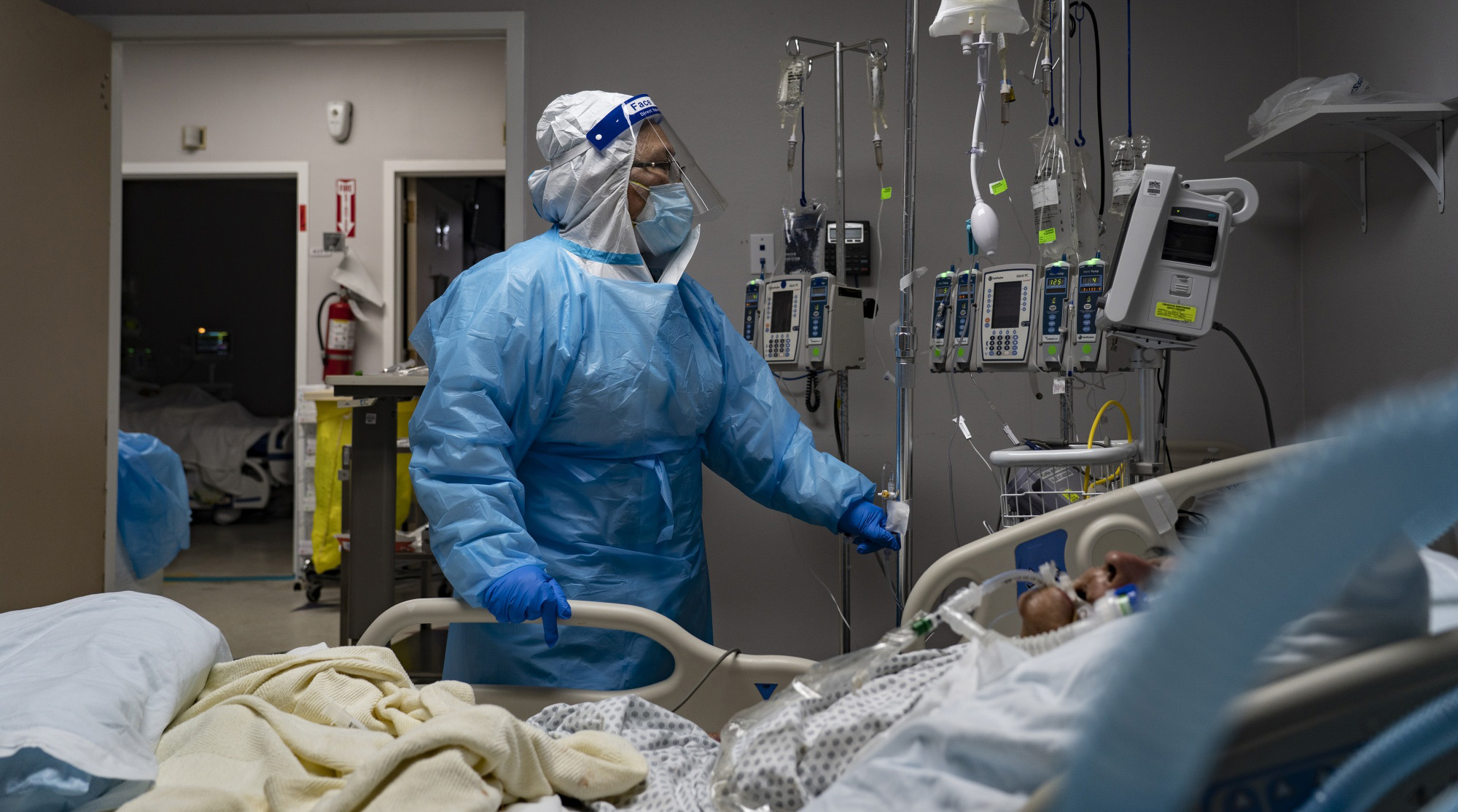 A healthcare worker treats a patient at the Covid-19 ICU of a hospital in Houston, Texas.