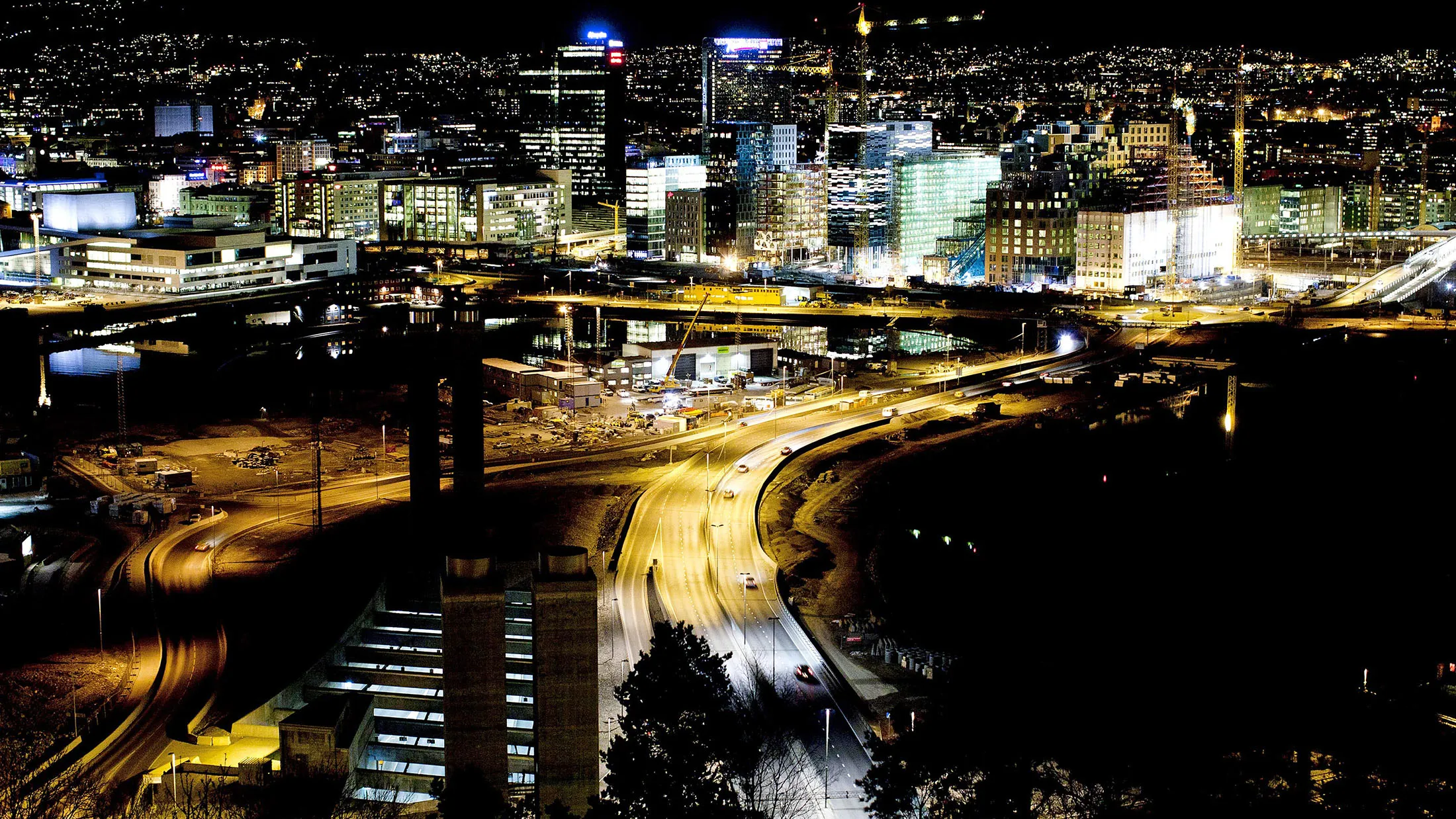 The city center skyline stands illuminated at night, seen from the Ekeberg hill, in Oslo, Norway, on Wednesday, March 21, 2012. Norway is moving closer to a housing bubble as the central bank's strategy of cutting interest rates to weaken the krone spurs credit growth and bloats property values.
