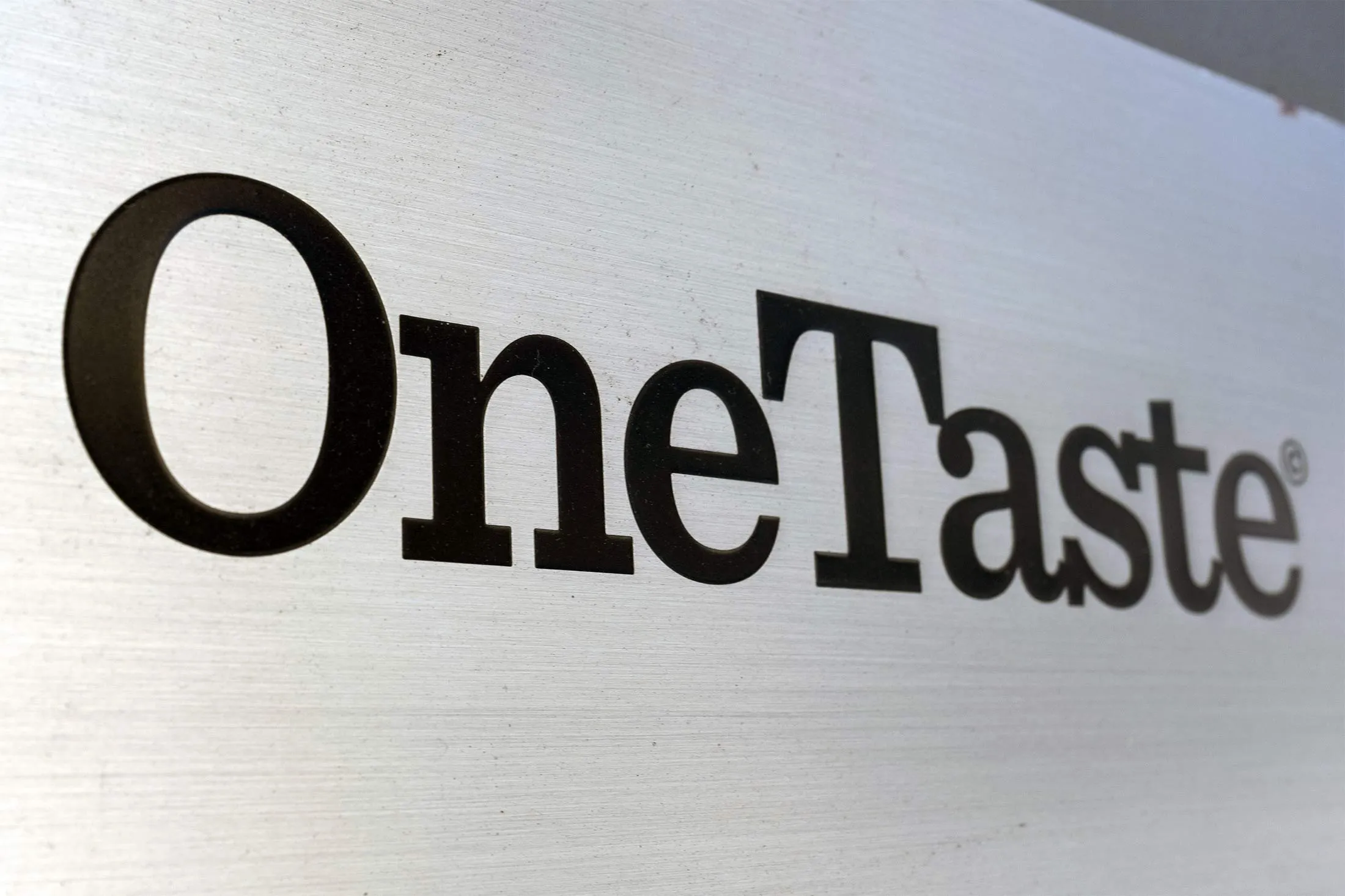 A OneTaste logo is seen outside its office in San Francisco, California.