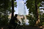 A cyclist rides past the European Central Bank headquarters&nbsp;in Frankfurt.