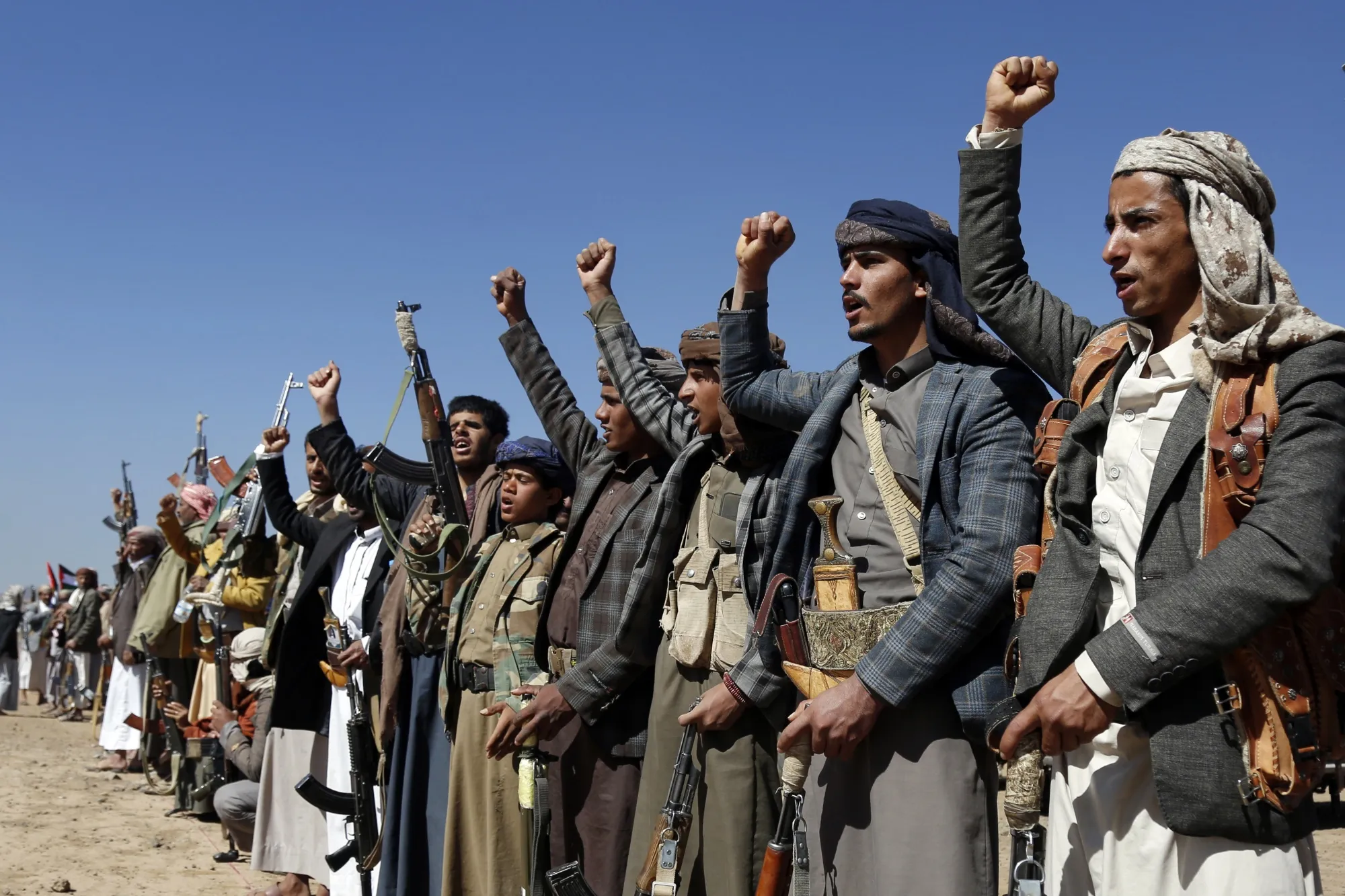 Houthi fighters and tribesmen stage a rally against the US and the UK&nbsp;strikes on Houthi-run military sites near Sanaa, Yemen.