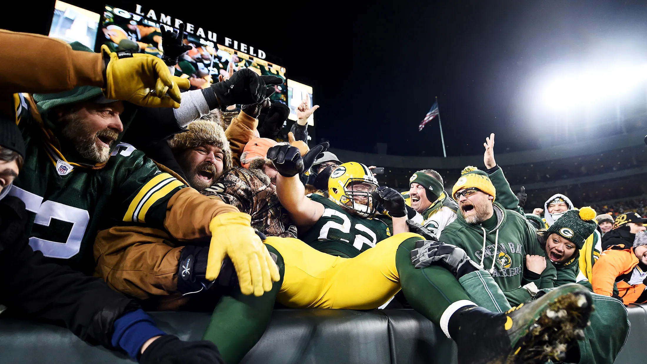 Aaron Ripkowski #22 of the Green Bay Packers celebrates with fans after scoring a touchdown in the fourth quarter during the NFC Wild Card game against the New York Giants at Lambeau Field on Jan.&nbsp; 8, 2017 in Green Bay, Wisconsin.&nbsp;