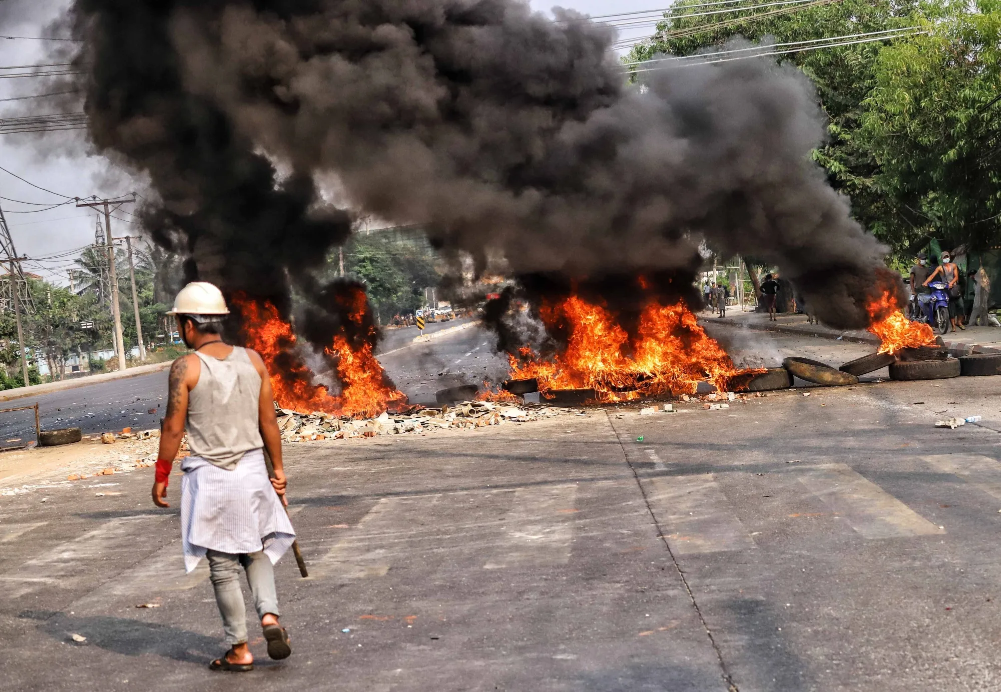 Protesters clash with security forces in in Hlaing Thar Yar Township, Yangon on March 14.