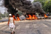 Protesters clash with security forces in in Hlaing Thar Yar Township, Yangon on March 14.