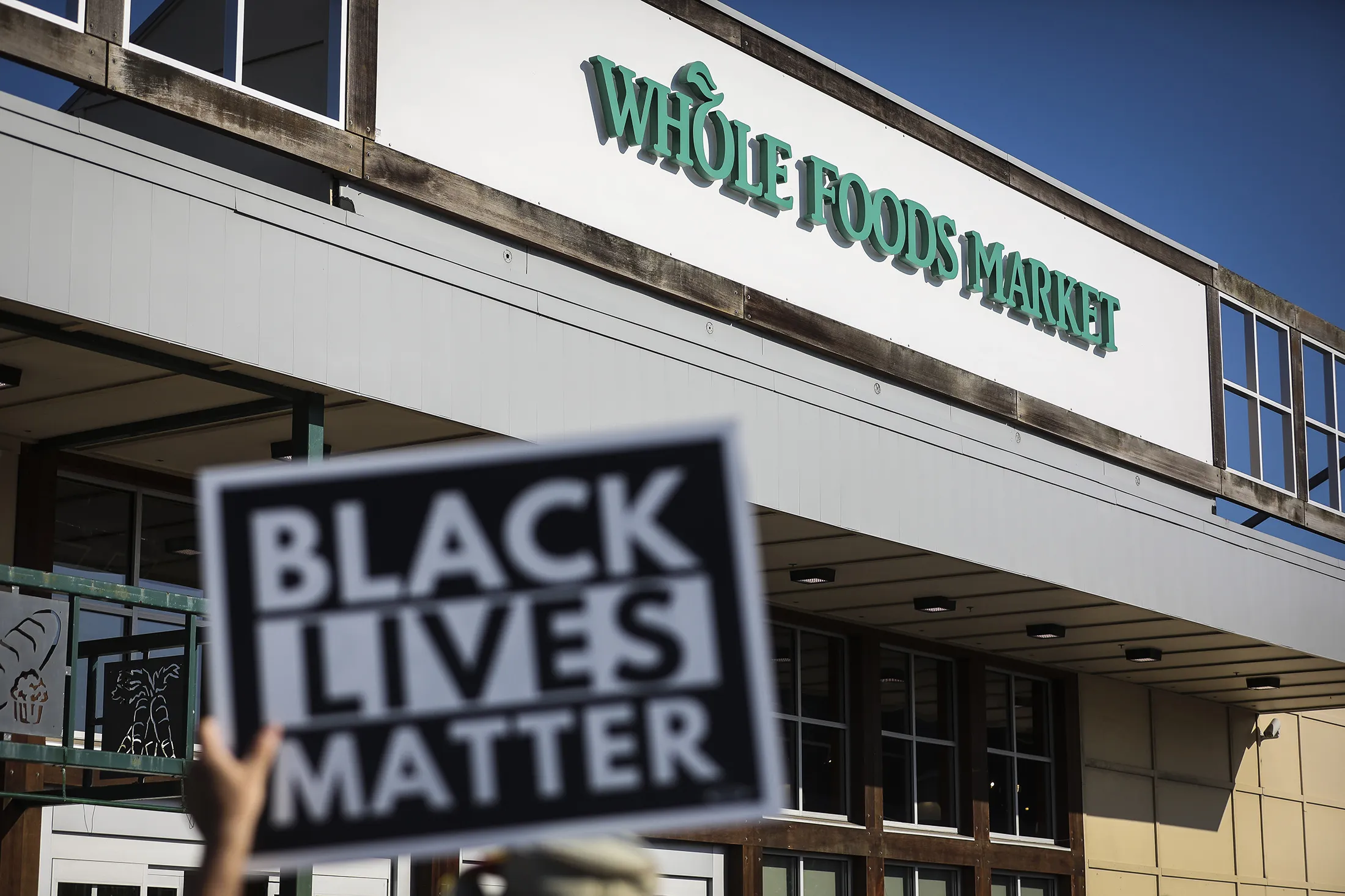 A demonstrator outside Whole Foods Market in Cambridge, Massachusetts, U.S., on July 18.