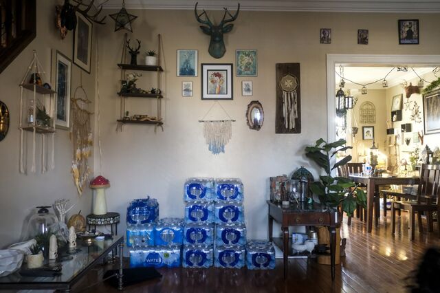 Packs of bottled water stacked in an East Palestine resident's home.