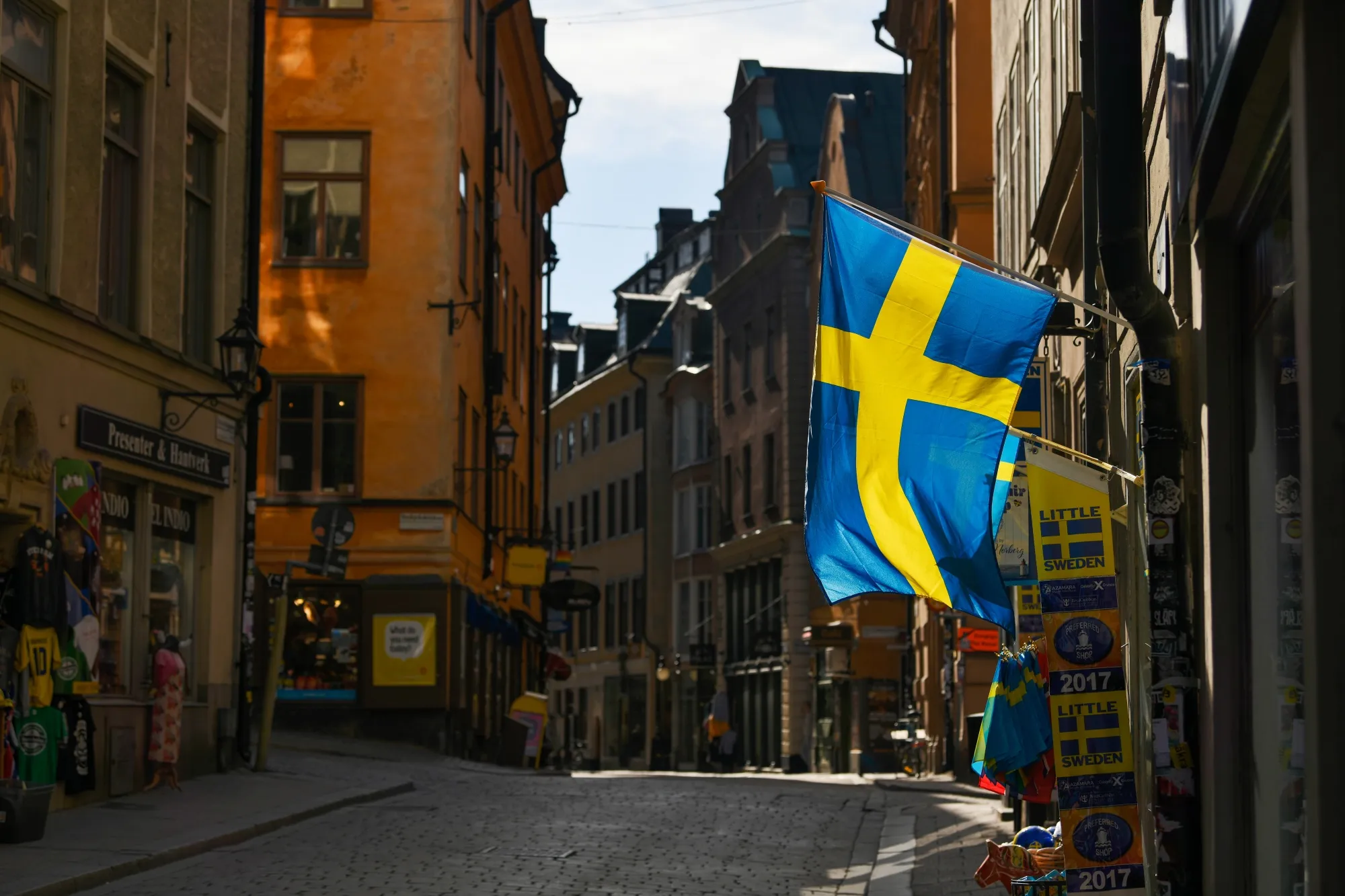 A tourist souvenir shop on a near empty road in Stockholm.