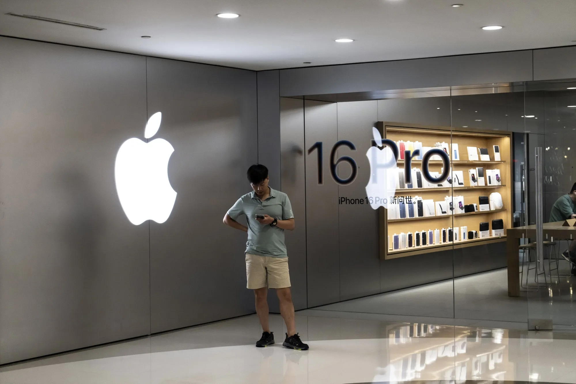 Signage for the Apple iPhone 16 Pro at an Apple Inc. store in Shanghai.