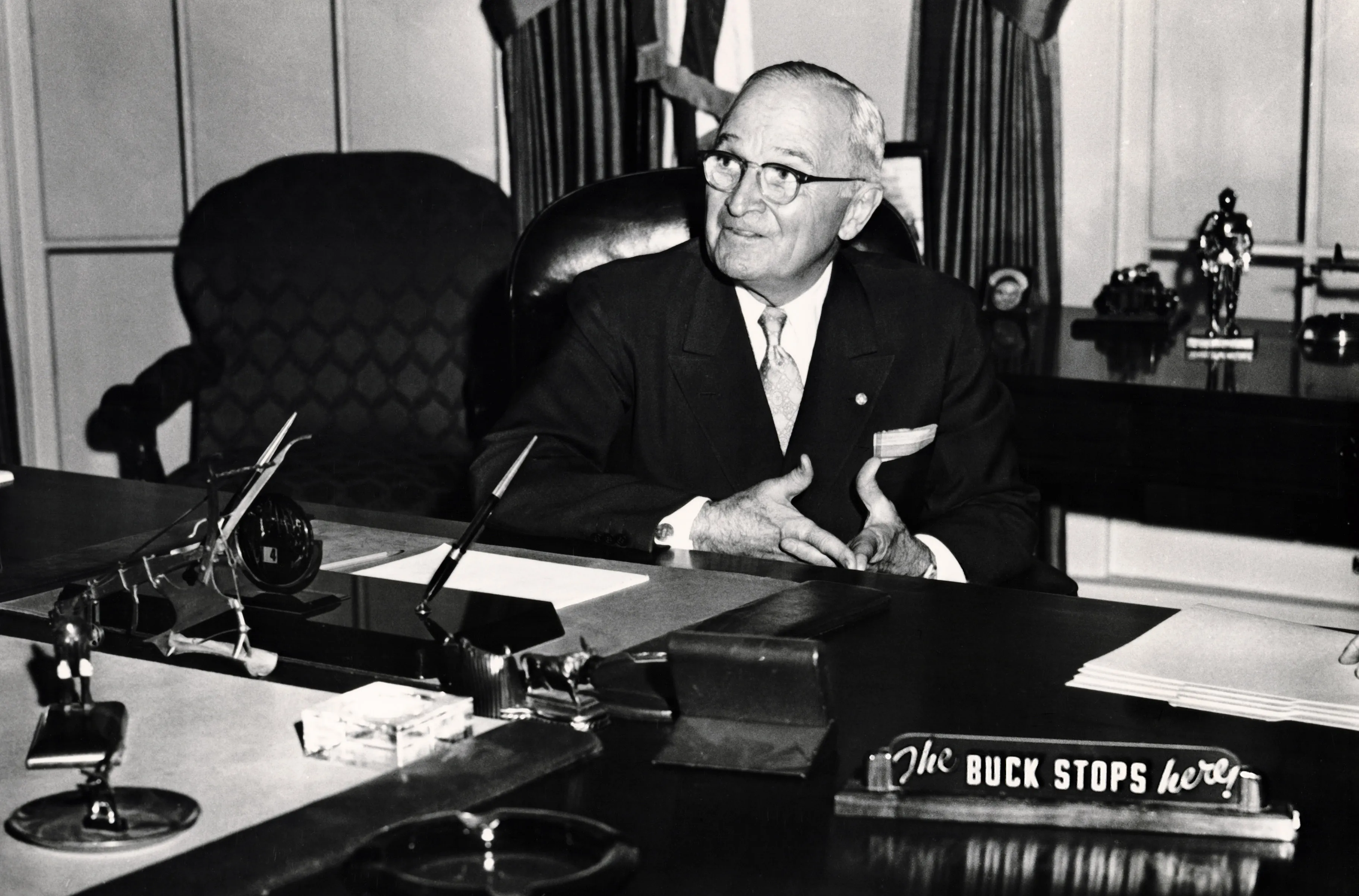 Harry Truman seated in the White House library, circa 1950.