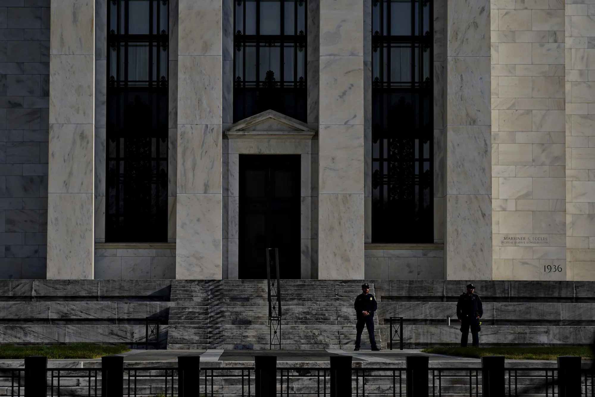 Federal Reserve police officers stand outside the Marriner S. Eccles building in Washington, D.C.