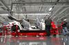 Tesla Motor associates work on the Model S electric car at the company's factory in Fremont, Calif.
