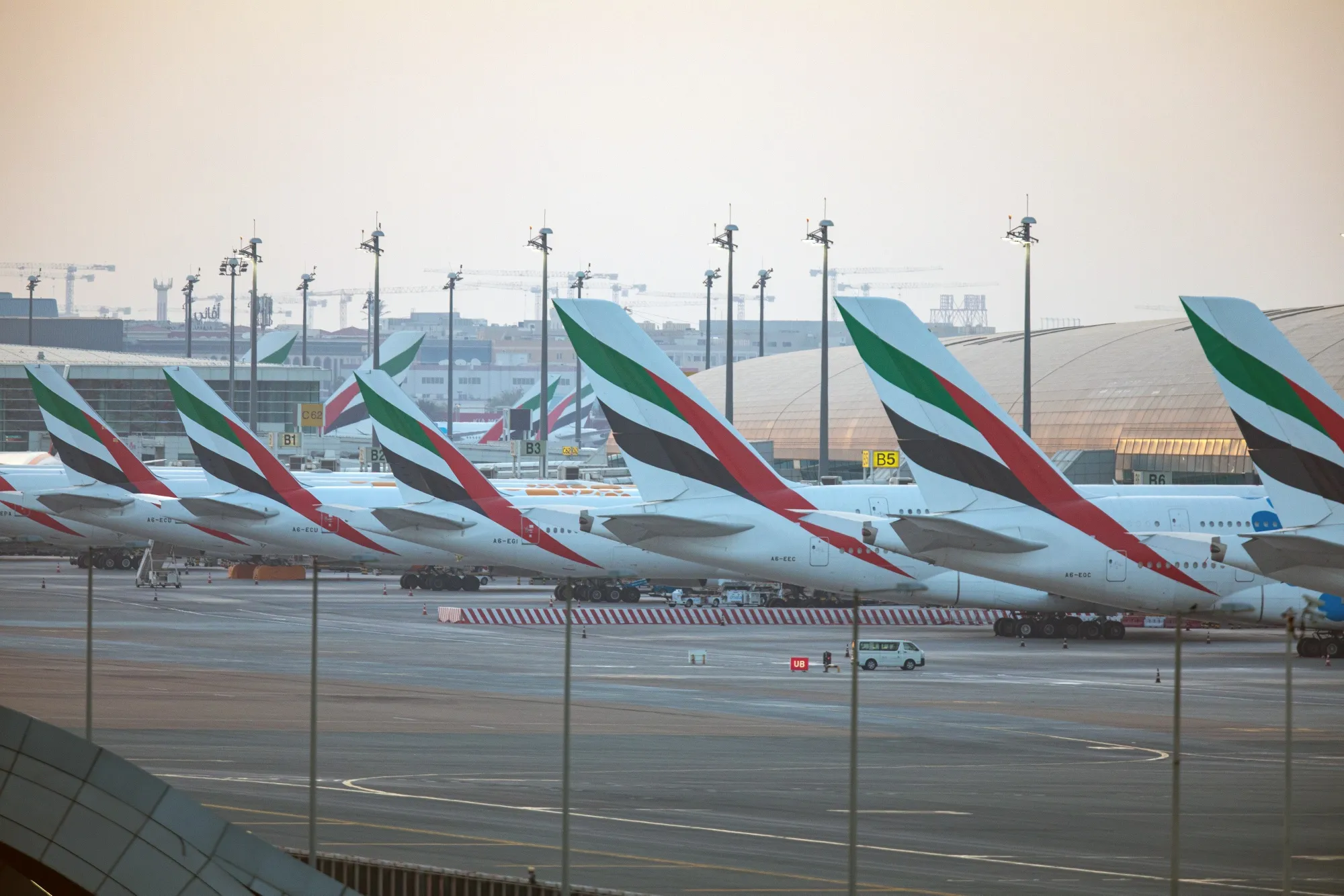 Emirates aircraft at the terminal building at Dubai International Airport.