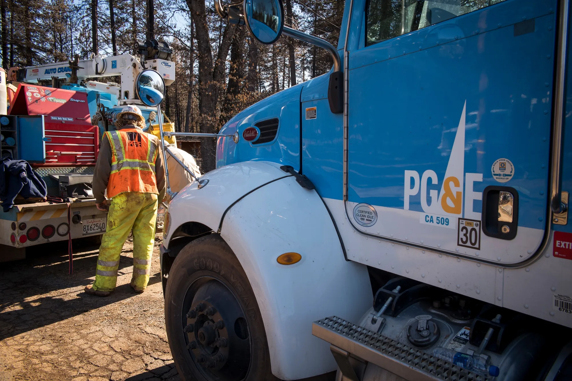 A Pacific Gas &amp; Electric Co.&nbsp;employee works in Paradise, California.