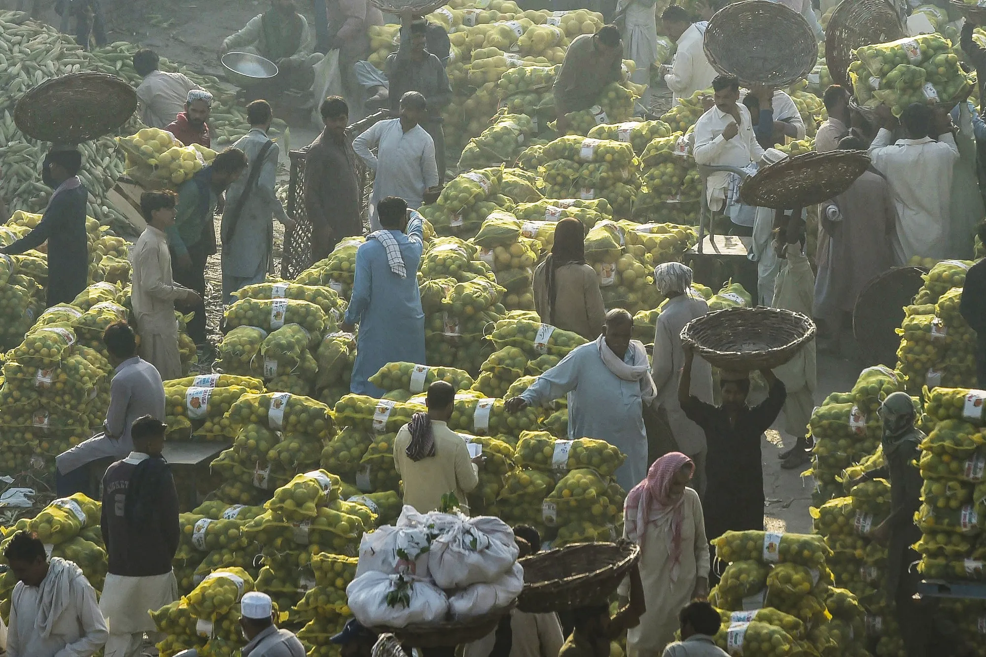 Traders gather at a fruit market&nbsp;in Lahore, Pakistan.