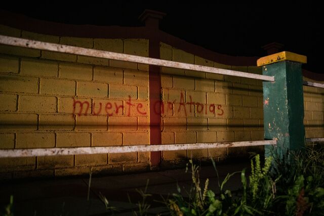 Grafitti against the Atala family, owners of DESA and alleged conspirators behind Berta Caceres' death, are scrawled across La Esperanza. Honduras, August 28, 2020.