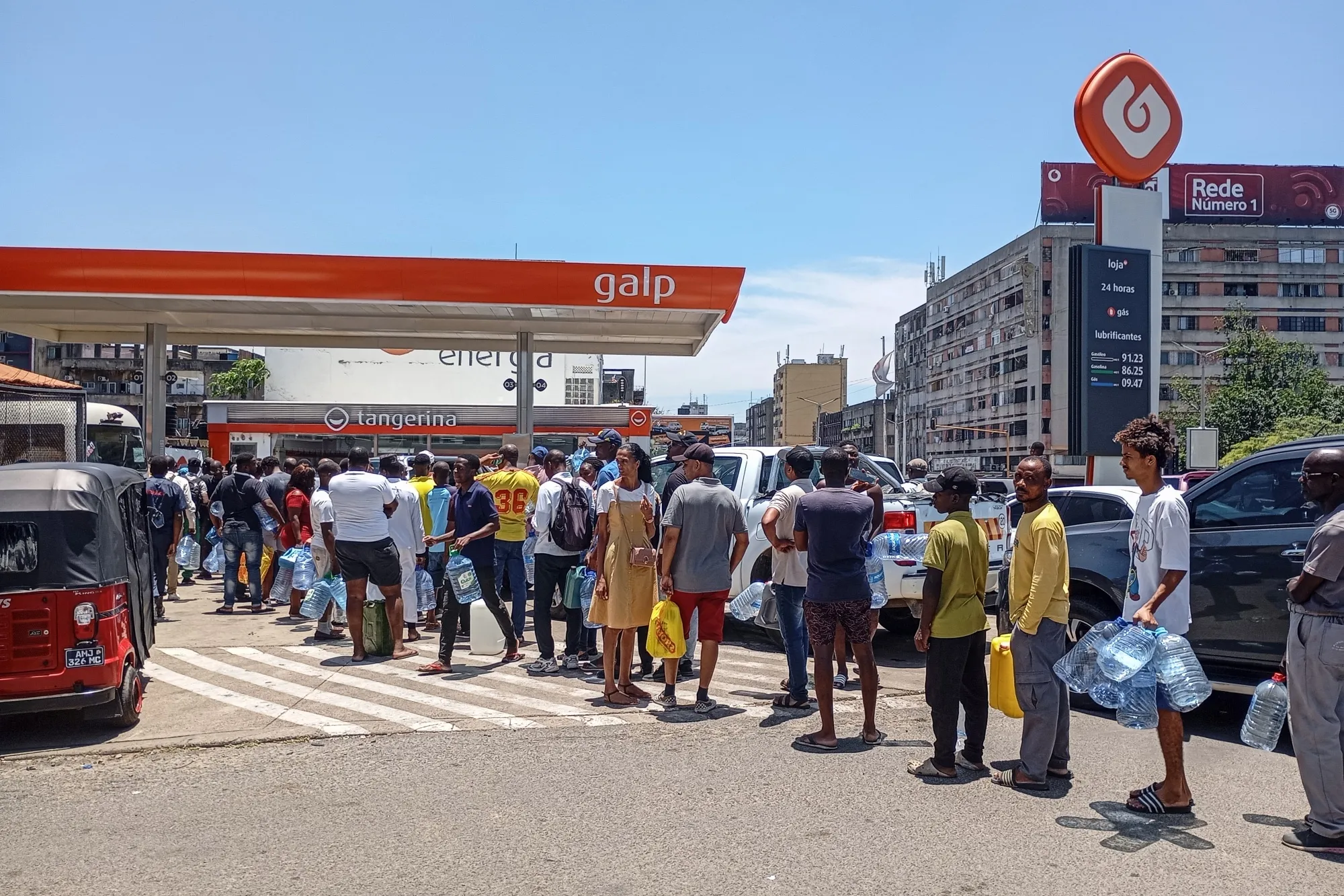 Motorists join long queues at a gas station in Maputo, Mozambique, in December. 
