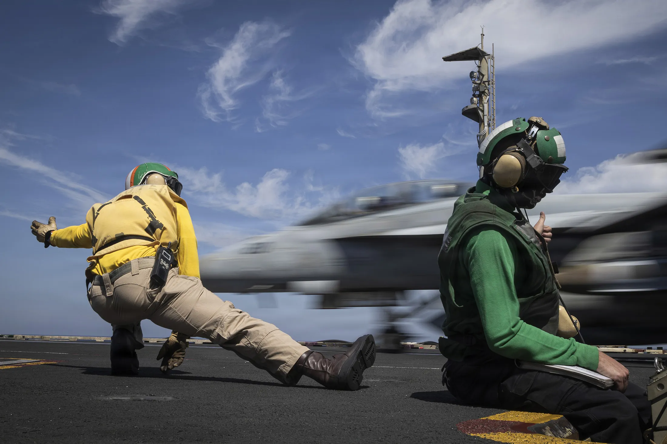 US&nbsp;Sailors signal the launch of an F/A-18F Super Hornet aircraft on the flight deck of the USS Gerald R. Ford during Operation Epic Fury on&nbsp;March 16.