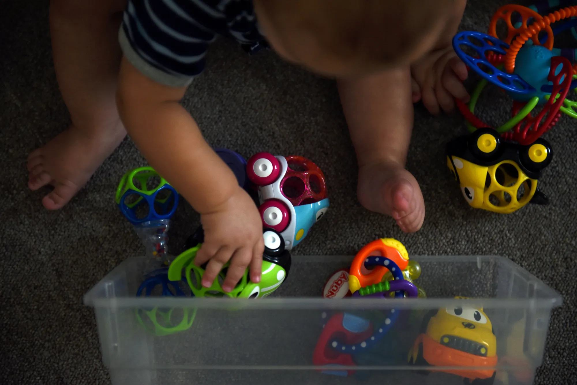 A baby plays with toys at a daycare center in Monahans, Texas.