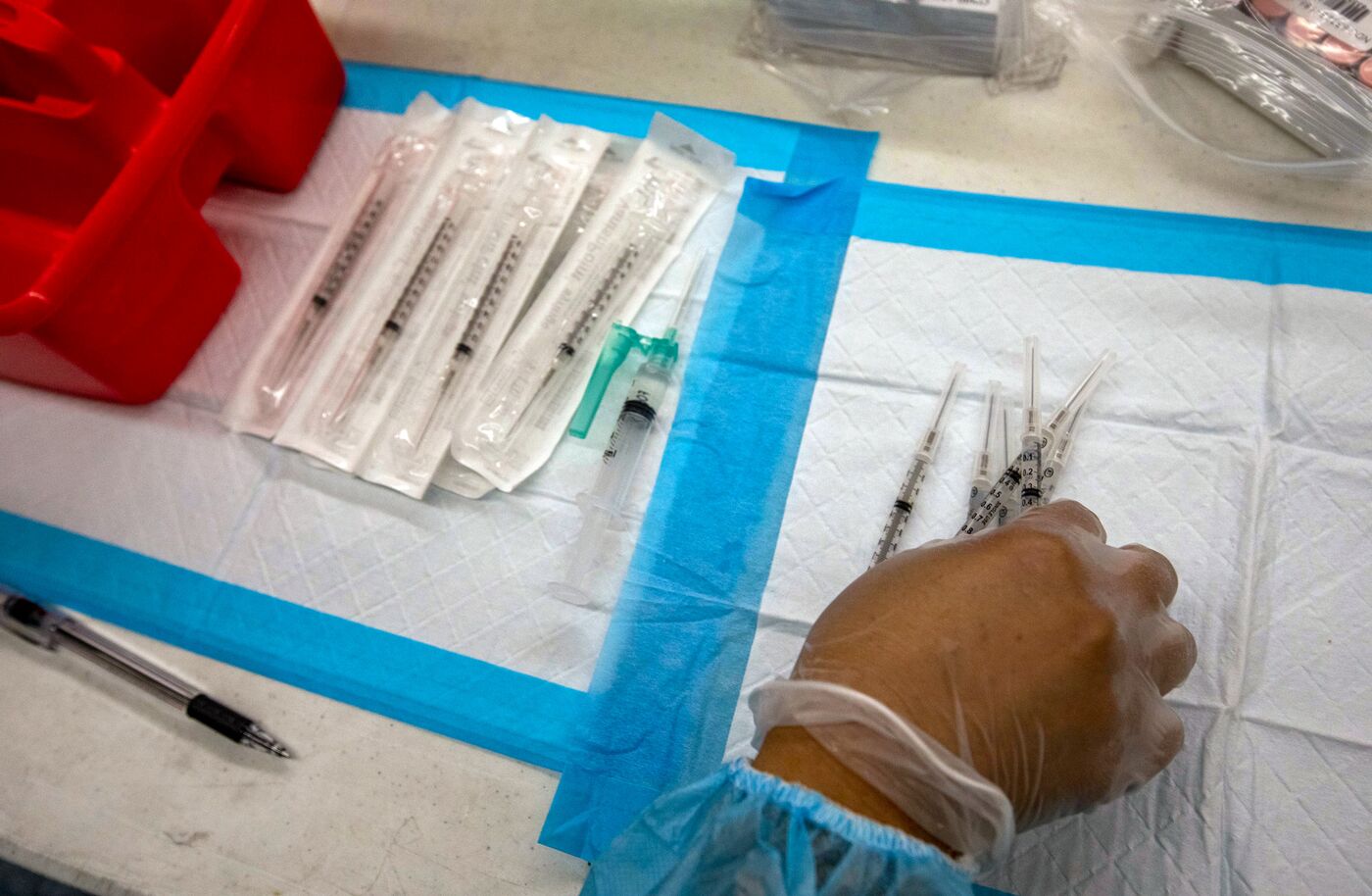 A nurse prepares doses of the Pfizer-BioNTech Covid-19 vaccine.