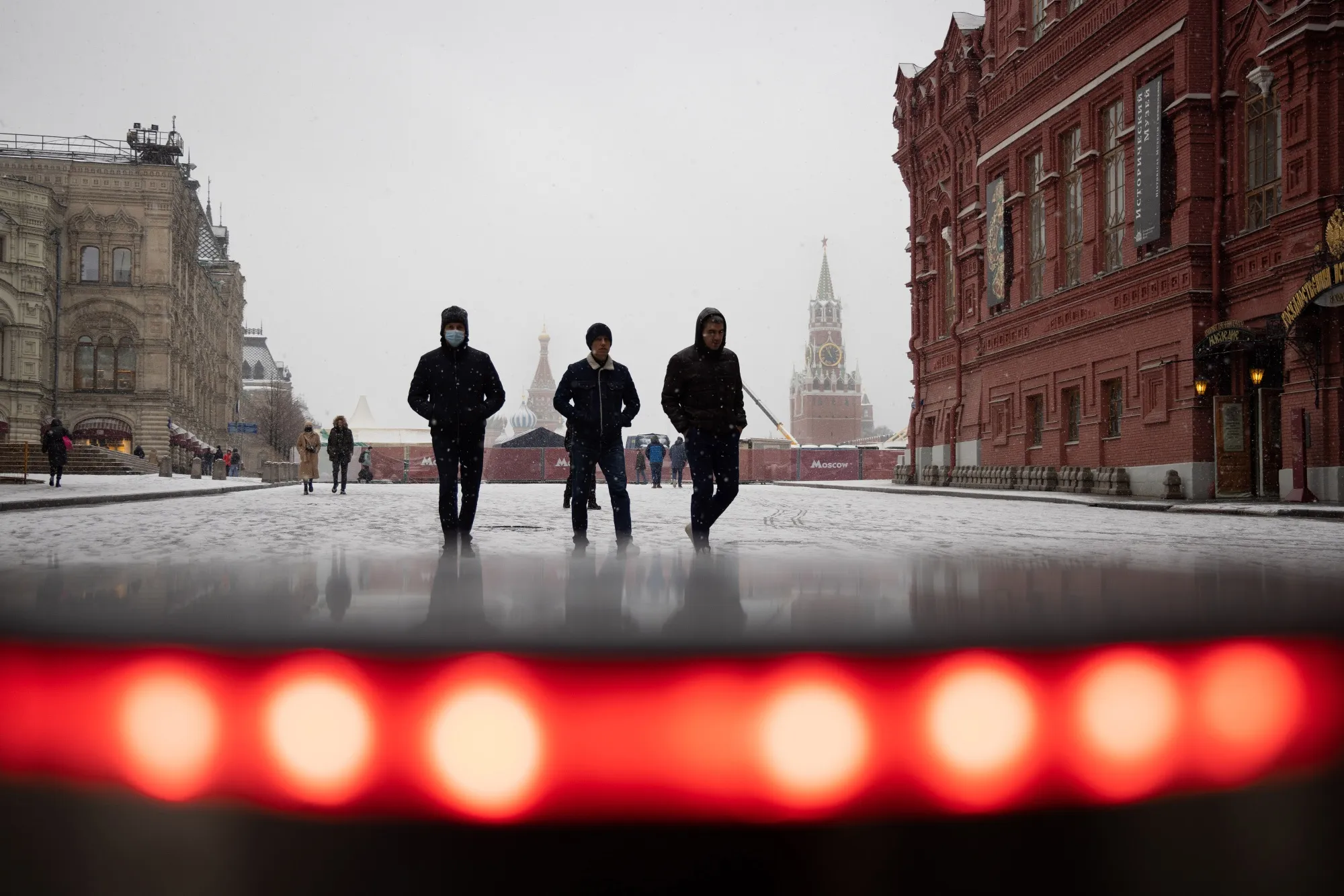 Pedestrians walk through Red Square in Moscow, Russia.