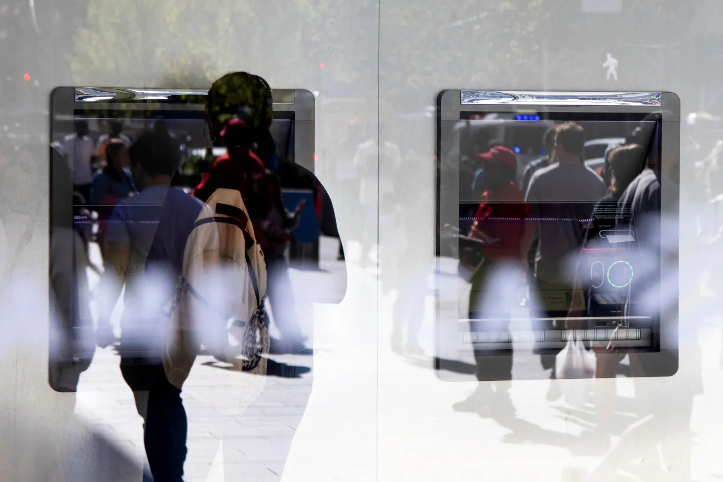 A customer uses an ATM&nbsp;in New York.