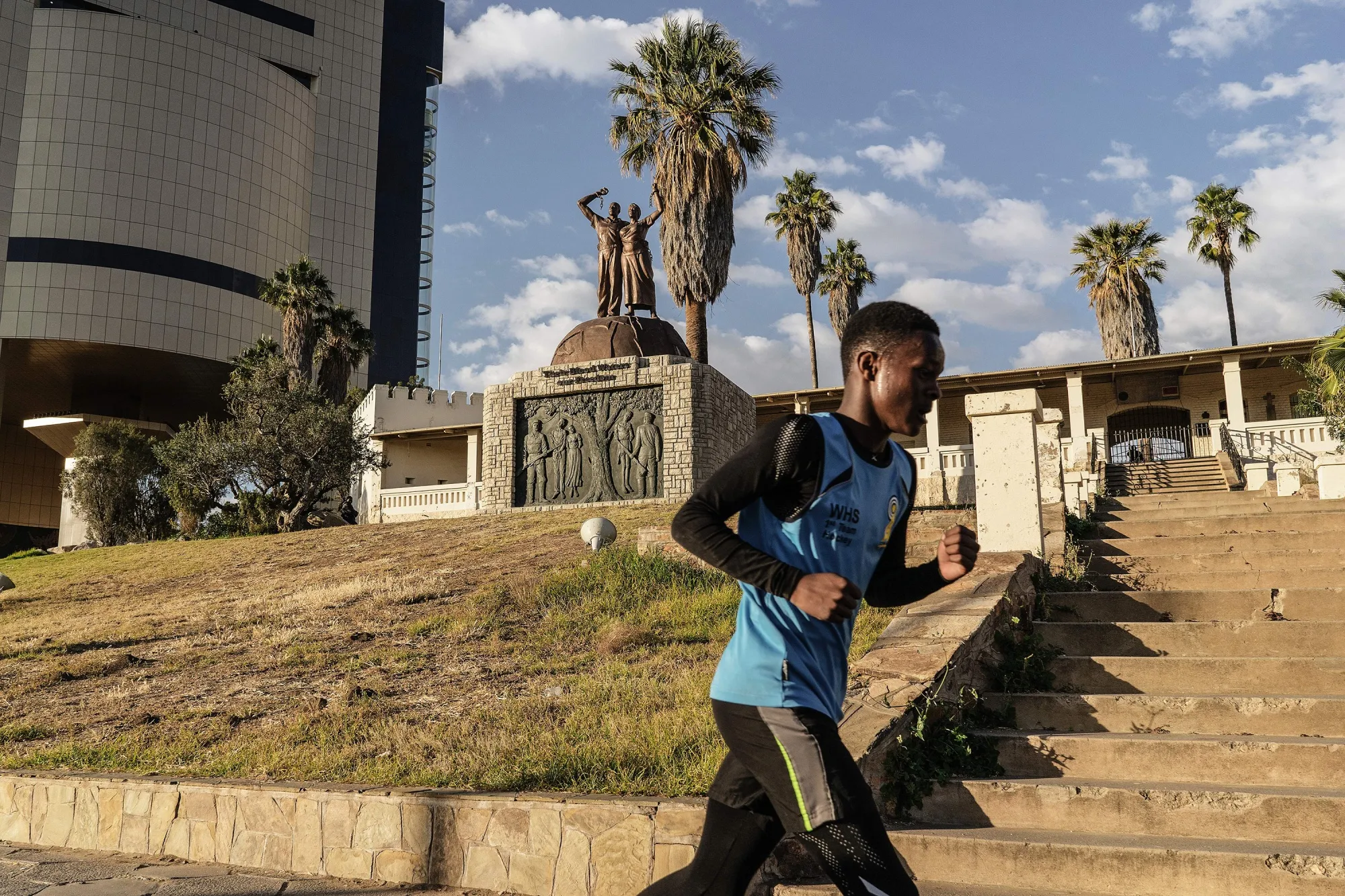 A boy jogs past a memorial in tribute to the victims of killings of&nbsp;Herero and Nama people in 1904,&nbsp;in Windhoek, Namibia.&nbsp;