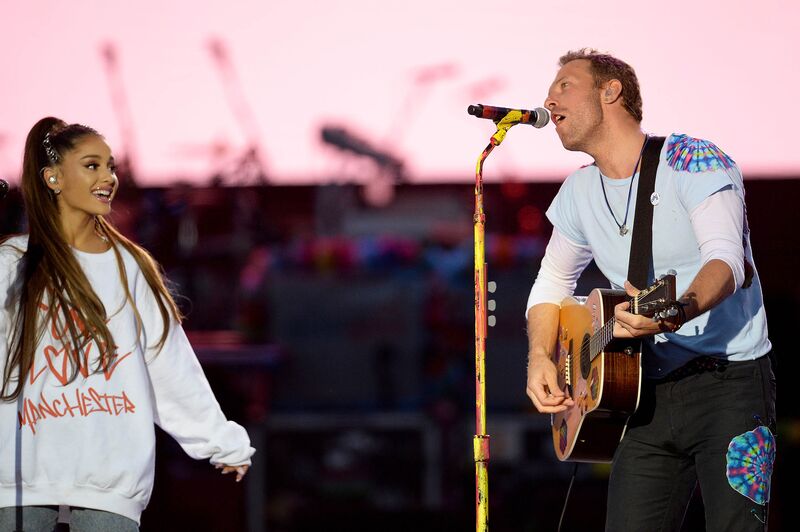 MANCHESTER, ENGLAND - JUNE 04:  NO SALES, free for editorial use. In this handout provided by 'One Love Manchester' benefit concert (L) Ariana Grande and Chris Martin perform on stage on June 4, 2017 in Manchester, England. Donate at www.redcross.org.uk/love  (Photo by Getty Images/Dave Hogan for One Love Manchester)