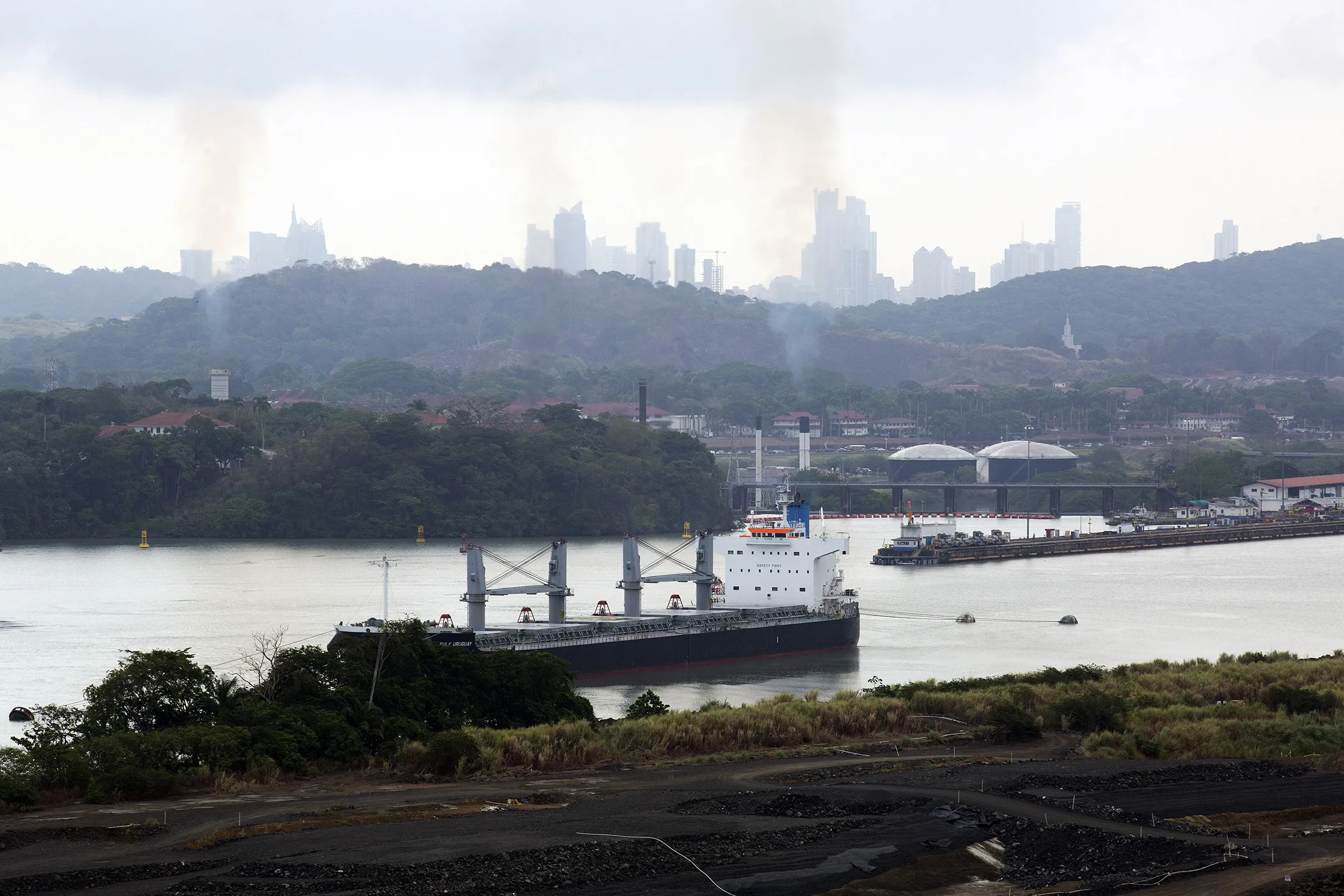 A vessel moves along the Panama Canal next to an excavation for the expansion of the canal near Panama City, Panama, on April, 24, 2014.
