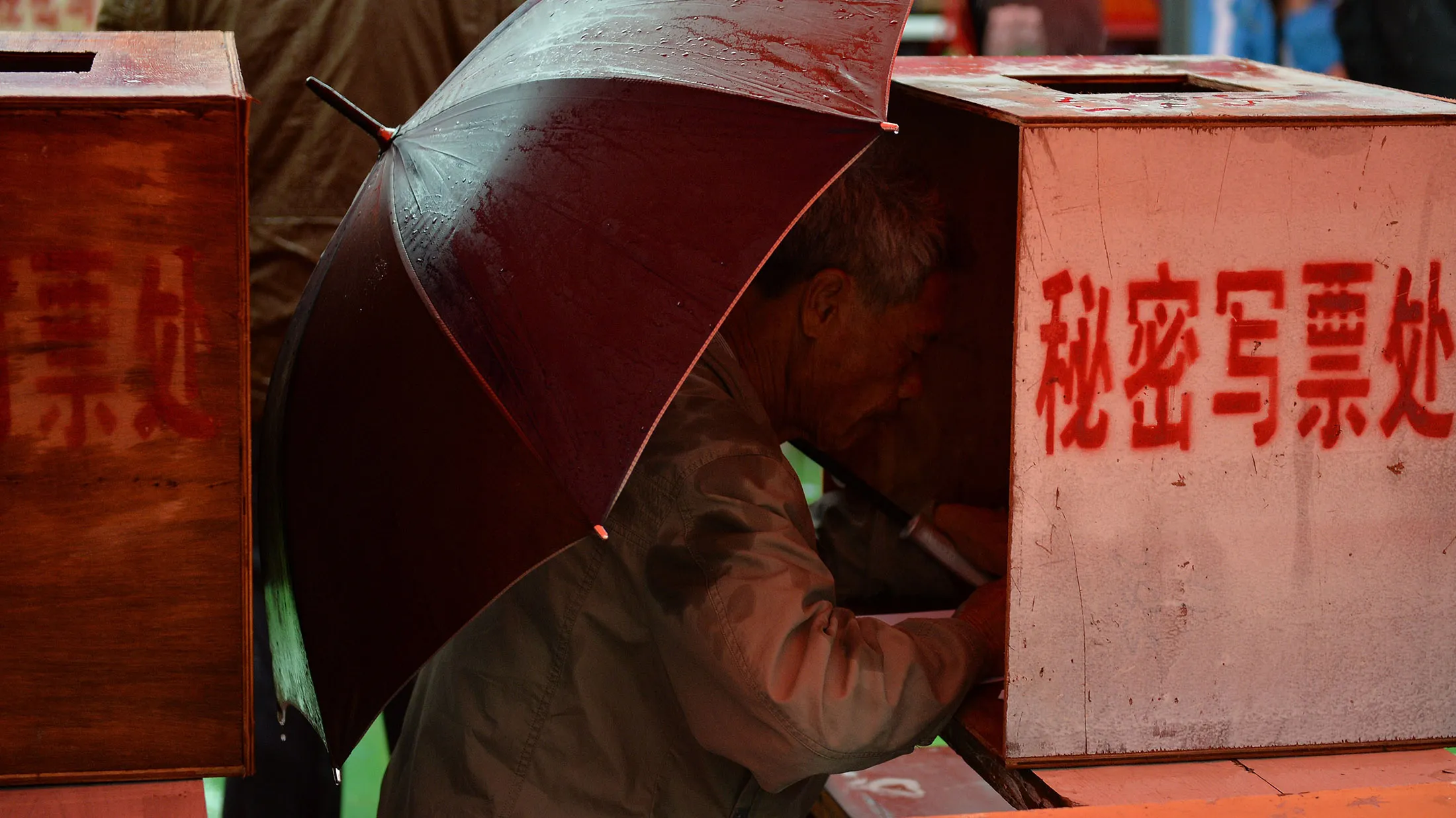 A local resident votes during elections in the village of Wukan on March 31, 2014. Polling stations opened on March 31 in the Chinese village of Wukan, which held landmark democratic elections after rebelling against Communist Party officials, but the new vote was shadowed by fears local authorities are reasserting their grip on power. AFP PHOTO/Mark RALSTON (Photo credit should read MARK RALSTON/AFP/Getty Images)
