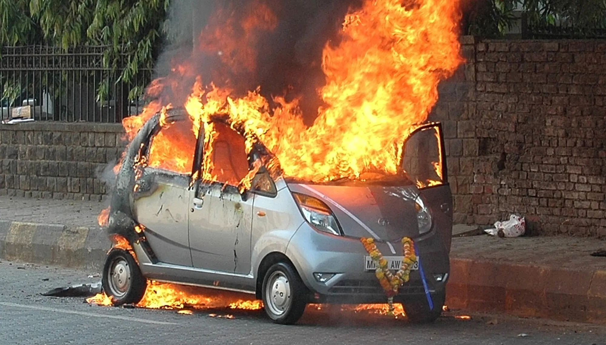 A Nano burns in the suburbs of Mumbai in 2010: A tendency to catch fire didn’t help its prospects.