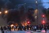 Smoke billows from burning tyres, pallets and fireworks during riots in Malmo, Sweden, on Aug. 28.