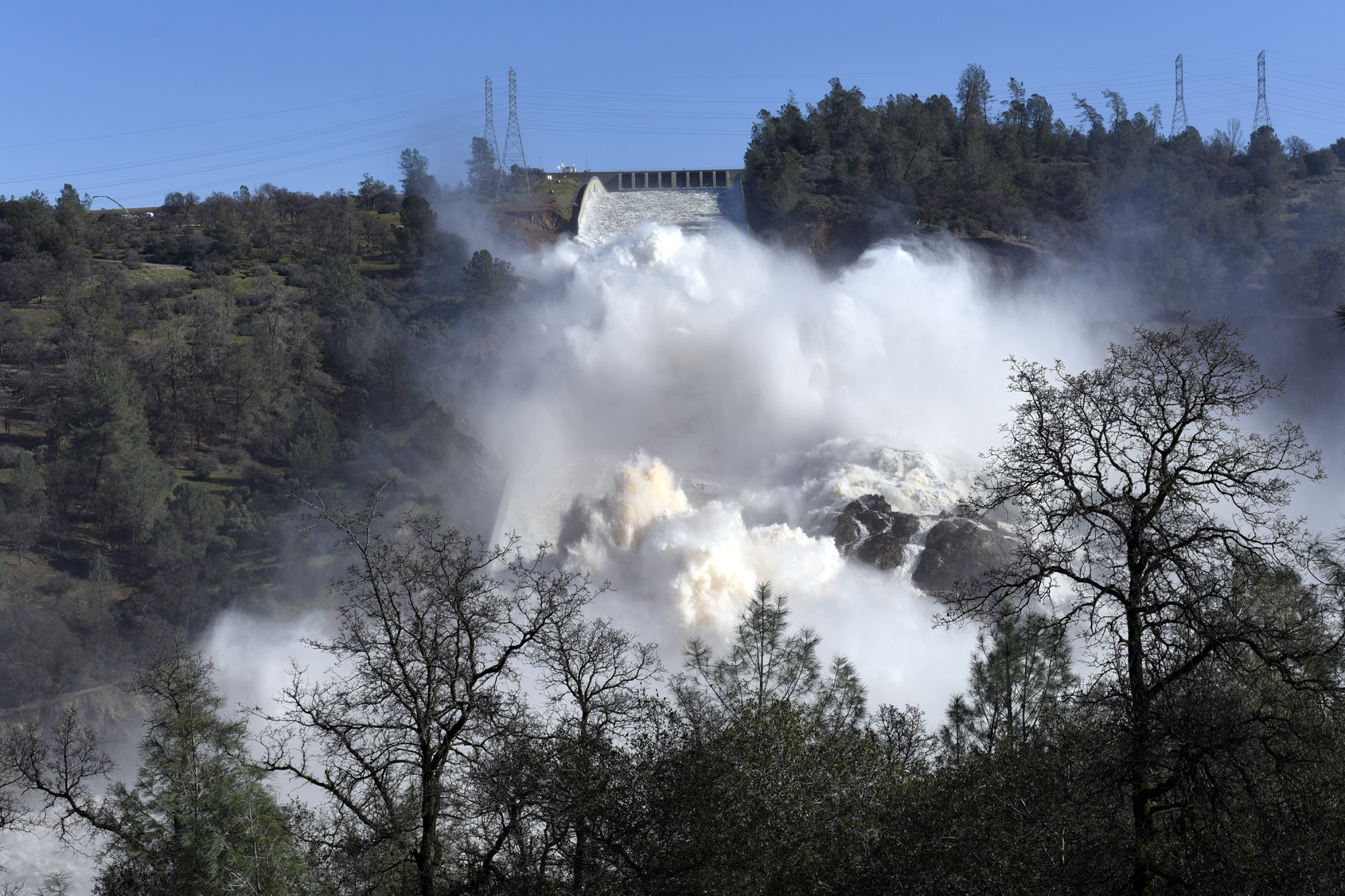 Water is released down the damaged primary spillway in Oroville on Feb. 14.
