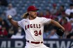 Los Angeles Angels starting pitcher Noah Syndergaard throws to the plate during the second inning of a baseball game against the Texas Rangers Tuesday, May 24, 2022, in Anaheim, Calif. (AP Photo/Mark J. Terrill)
