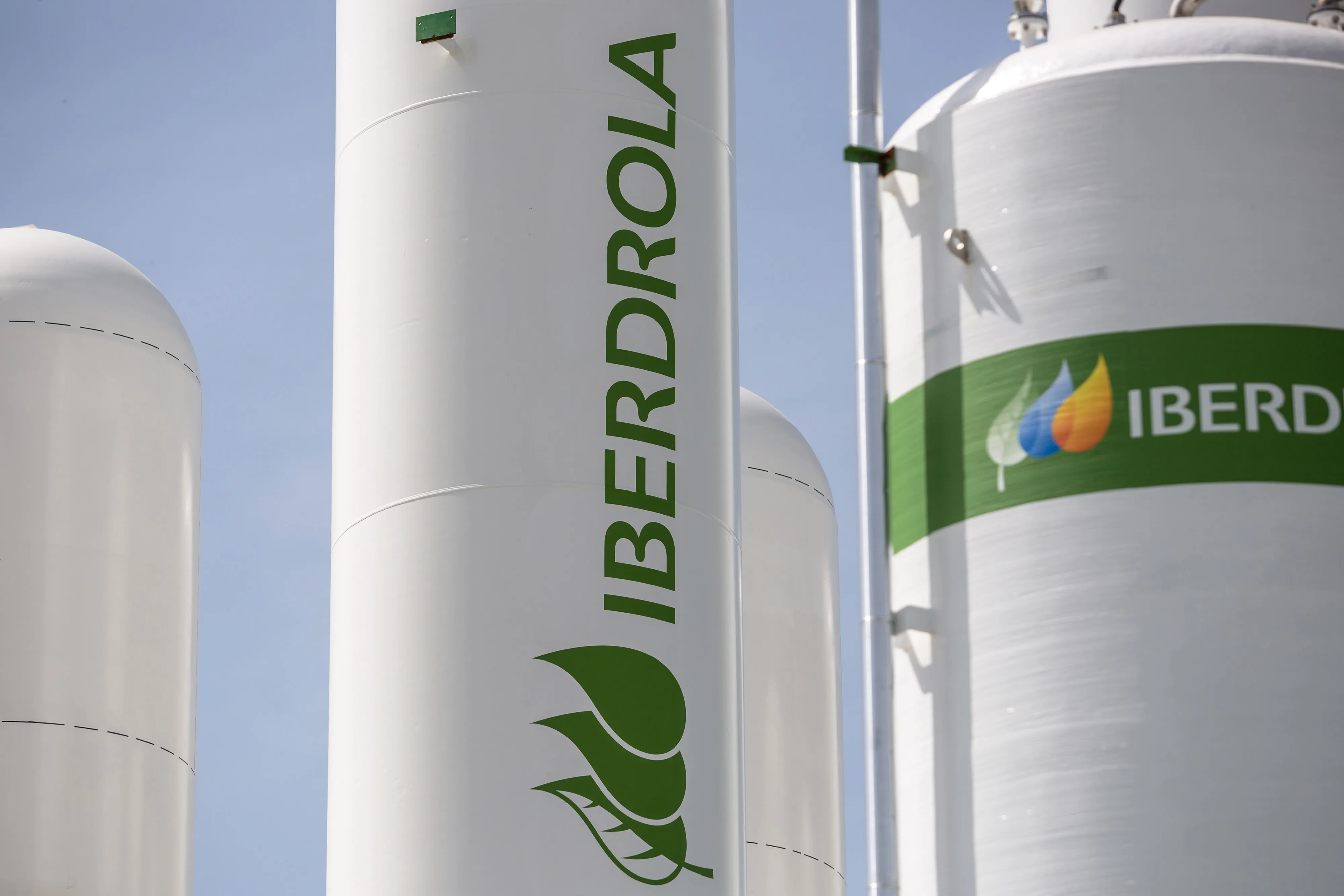 The Iberdrola logo on hydrogen storage tanks during the final stages of construction at Iberdola SA's Puertollano green hydrogen plant in Puertollano, Spain, on Thursday, May 19, 2022.