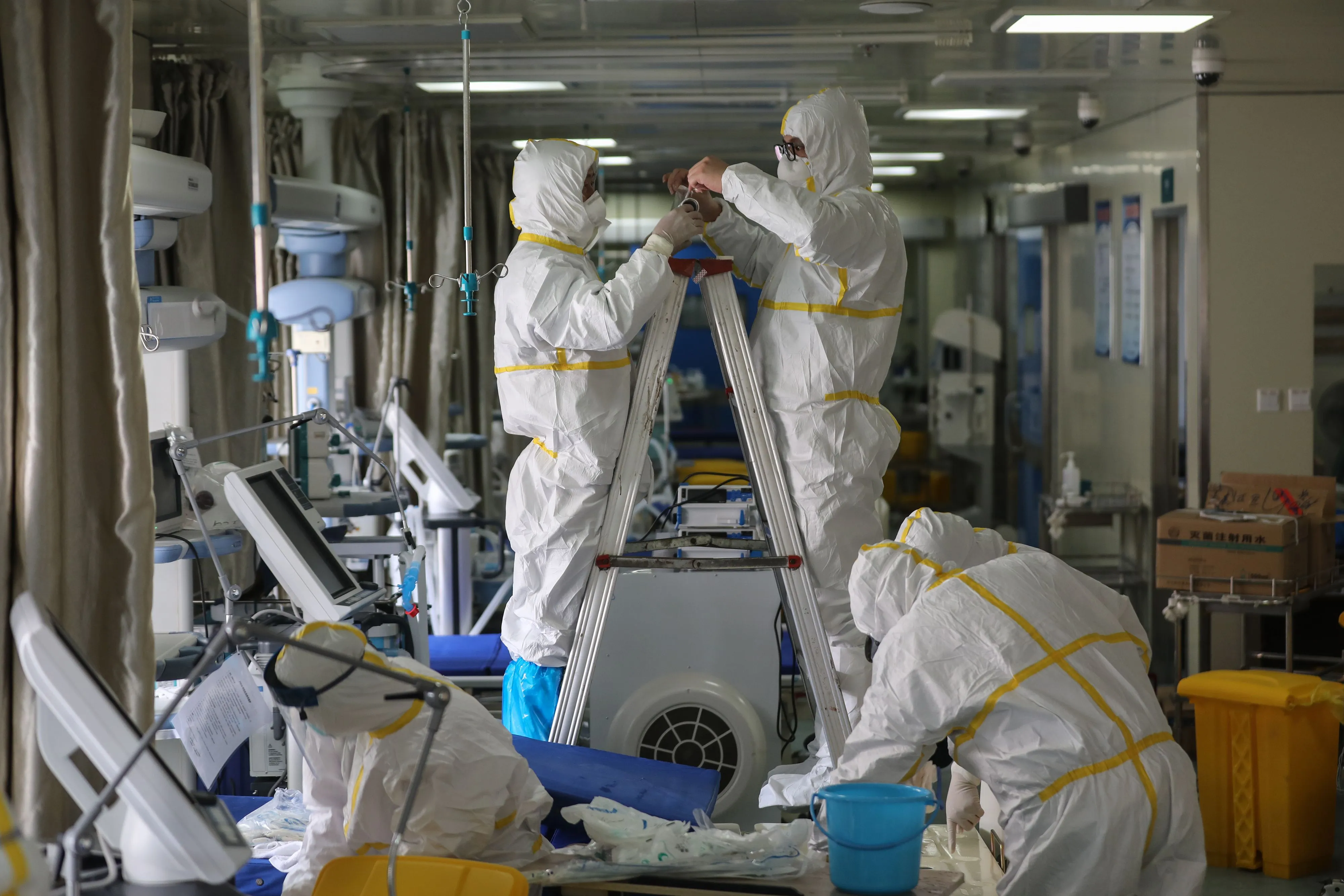 Medical staff seal a vent at a ward used as an isolation ward for coronavirus patients at a hospital in Wuhan, March 12.